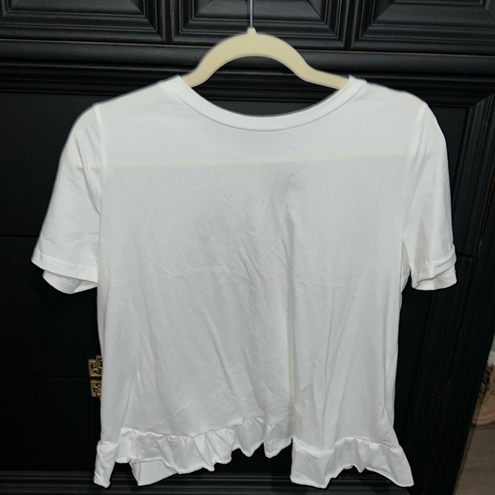 Plain white tee shirt with ruffle in back